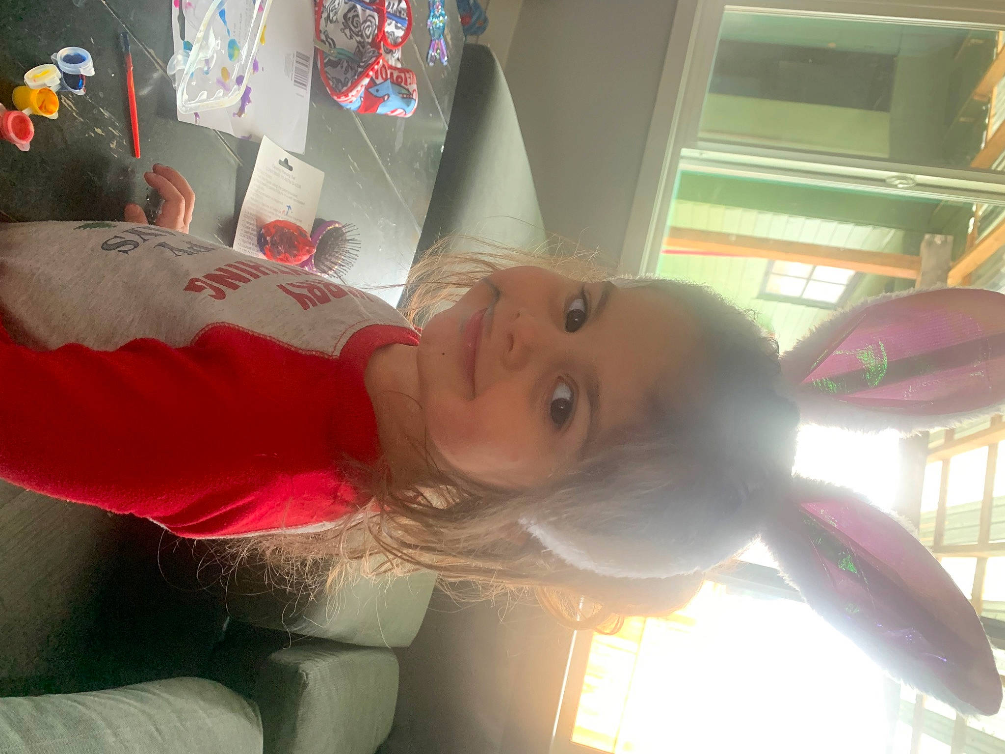 Mia is registered to the contest to win money with this photo: auto_part, car, carmine, chest, child, fun, happy, human_leg, joy, magenta, party_supply, person, room, toddler, toy, window