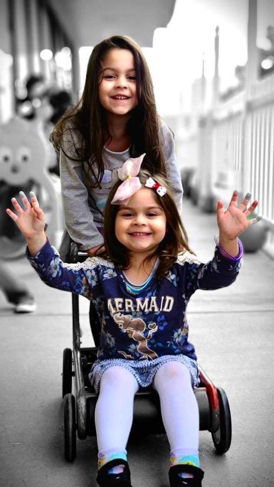 Mia is registered to the contest to win money with this photo: arm, black, eye, face, fun, gesture, hand, happy, head, headwear, joy, leisure, organ, people, person, photograph, skin, smile, standing, tire