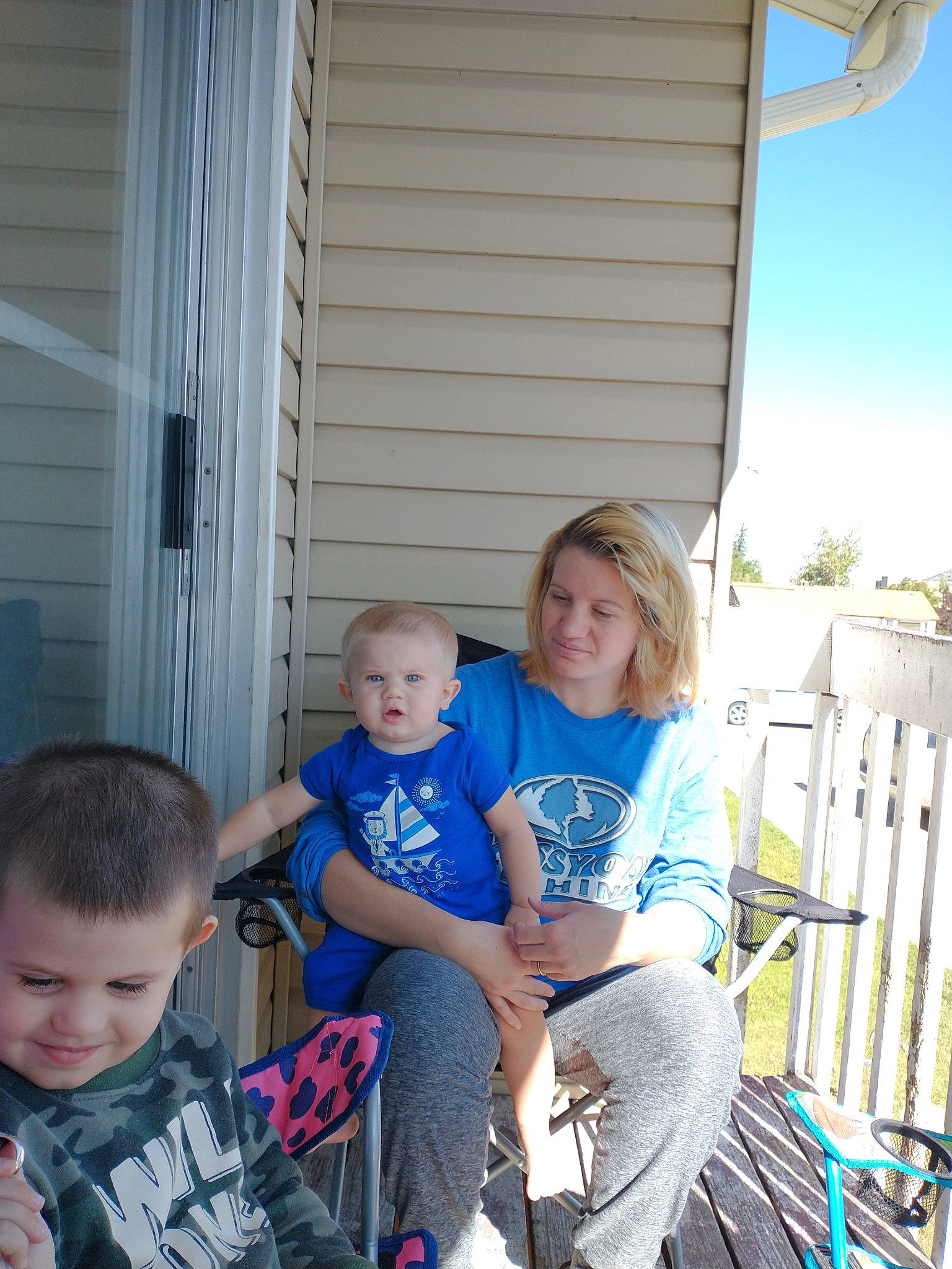 Tristen joined the competition — help win amazing prizes! chair, child, electric_blue, event, fun, grass, hair, house, joy, lap, leisure, mammal, person, recreation, sitting, smile, summer, t_shirt, toddler, travel