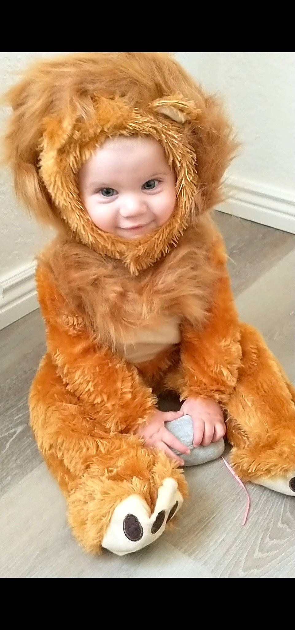 Tristen is registered to the contest to win money with this photo: animal_product, companion_dog, eye, face, fawn, fur_clothing, glove, head, human_body, jacket, long_hair, natural_material, nose, orange, outerwear, person, skin, smile, textile, toy