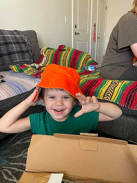 Jameson joined the competition — help win amazing prizes! baby, baseball_cap, cap, car_seat, chair, child, comfort, couch, fun, happy, headwear, joy, lap, leisure, pattern, person, personal_protective_equipment, room, sitting, smile