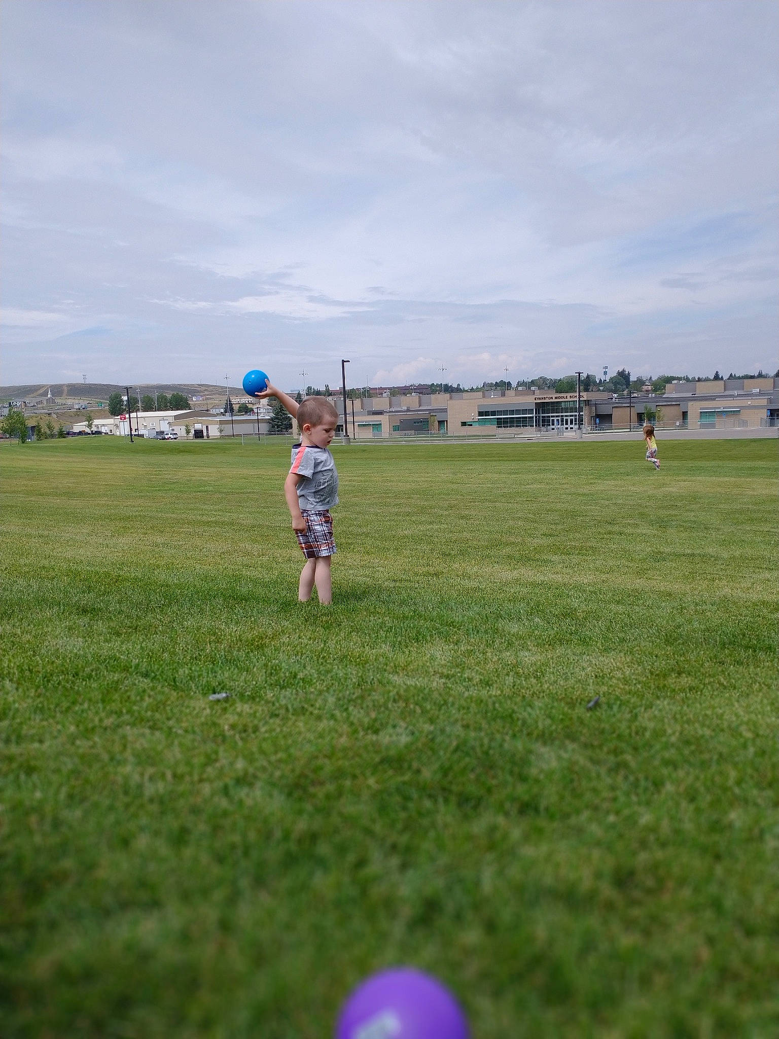 Jameson is registered to the contest to win money with this photo: cloud, daytime, field, fun, grass, grass_family, grassland, landscape, lawn, leisure, meadow, person, plain, plant, player, prairie, sky, sports, sports_equipment, team_sport