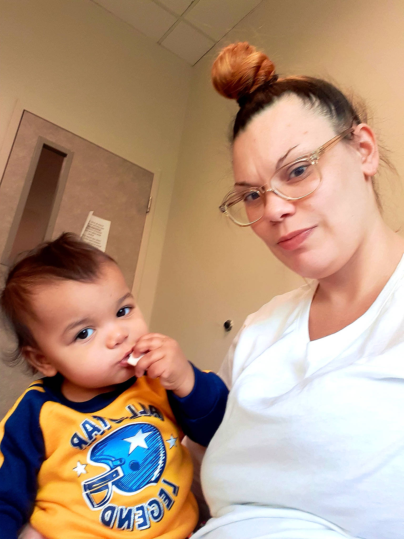 Alganon is registered to the contest to win money with this photo: abdomen, arm, baby, baby_toddler_clothing, cheek, child, event, eyewear, face, fun, gesture, glasses, happy, person, room, service, sitting, skin, t_shirt, toddler