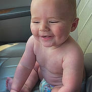 Rhyker joined the competition — help win amazing prizes! baby, car_interior, car_seat, child, chubby, cute, diaper, expression, face, hands, happy, human, indoor, infant, seatbelt, sitting, skin, smiling, sunlight, toes