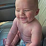 baby, car_interior, car_seat, child, chubby, cute, diaper, expression, face, hands, happy, human, indoor, infant, seatbelt, sitting, skin, smiling, sunlight, toes