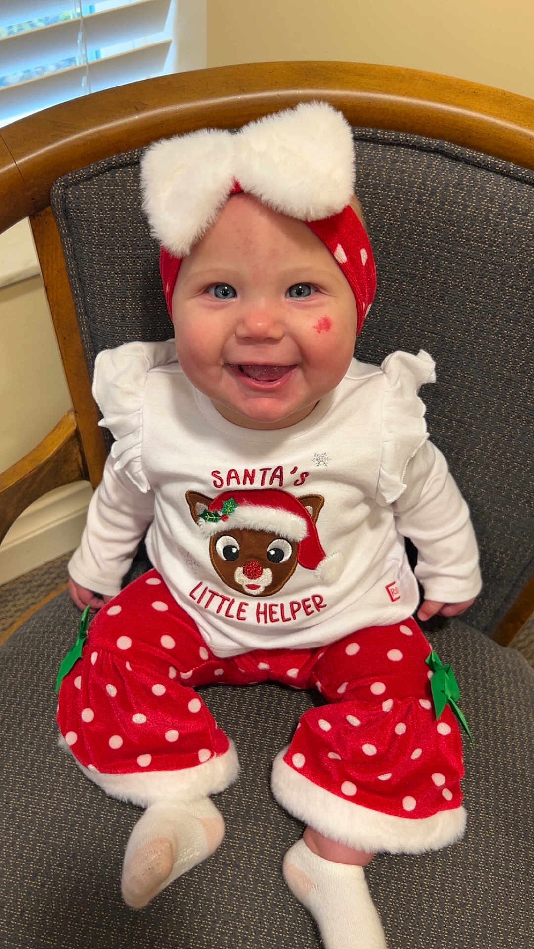 Sienna joined the competition — help win amazing prizes! baby, child, smiling, sitting, chair, headband, bow, red_pants, polka_dot, white_socks, holiday_clothing, cute, indoors, face, person, happy, festive, christmas, costume, plush