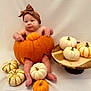 Sienna joined the competition — help win amazing prizes! baby, pumpkin, headwrap, orange, white_pumpkins, wooden_platter, fall, autumn, cute, child, sitting, holiday, decor, seasonal, costume, indoors, soft_lighting, plush, smile, skin