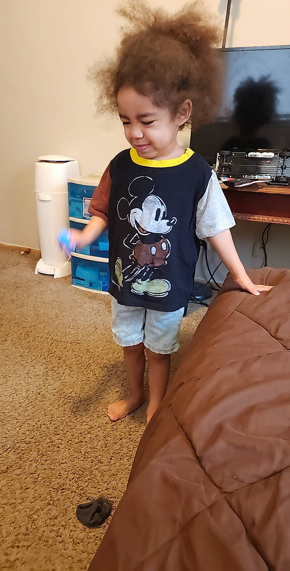 Keenan is registered to the contest to win money with this photo: child, electric_blue, flooring, fun, hairstyle, hardwood, household_supply, human_leg, joint, paper_towel, person, room, shorts, sitting, sleeve, standing, t_shirt, thigh, toddler, toilet_paper