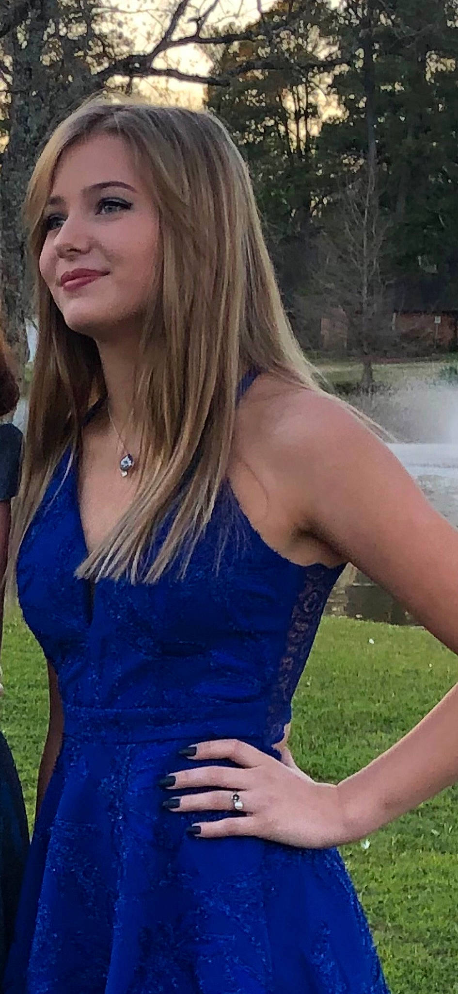 Calista is registered to the contest to win money with this photo: arm, blue, day_dress, dress, face, fashion, grass, hair, happy, iris, joint, joy, light, neck, one_piece_garment, people_in_nature, person, shoulder, smile, strapless_dress