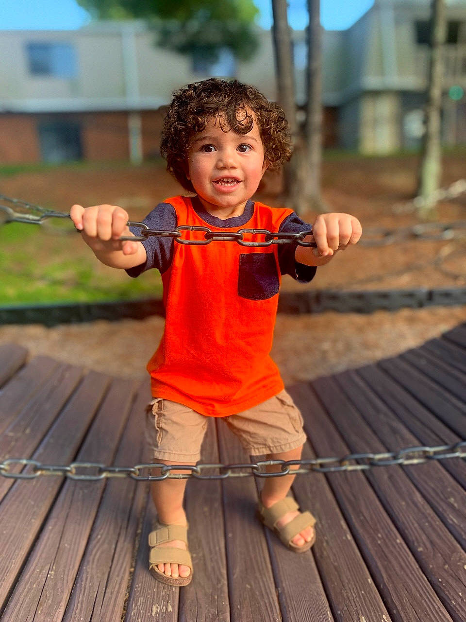 Omari is registered to the contest to win money with this photo: child, fun, grass, happy, hardwood, leaf, leisure, orange, people_in_nature, person, recreation, shorts, sky, standing, summer, t_shirt, thumb, toddler, tree, wood