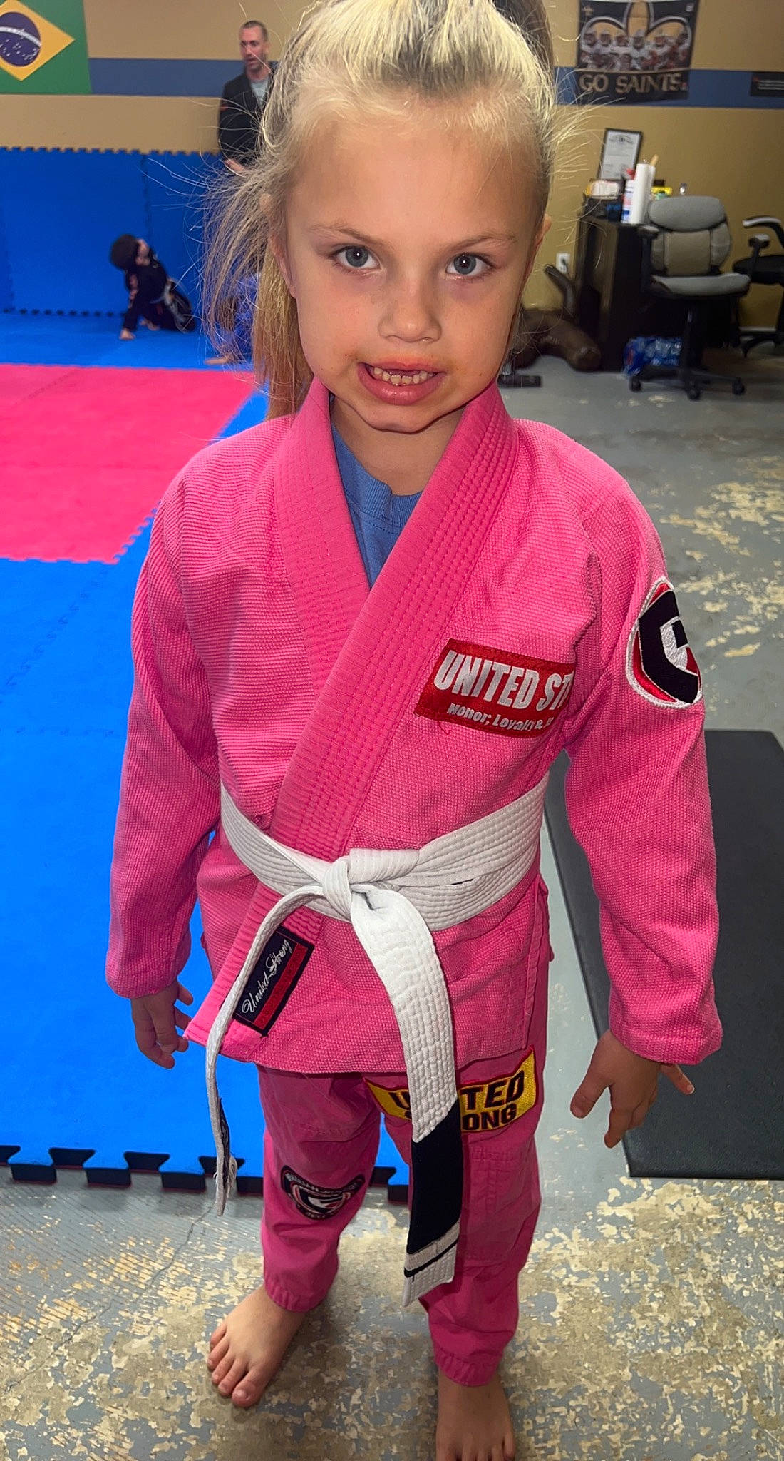 Joslyn joined the competition — help win amazing prizes! blue, championship, chin, combat_sport, competition_event, contact_sport, electric_blue, eye, face, hair, head, japanese_martial_arts, martial_arts, martial_arts_uniform, person, sleeve, smile, sports, sports_uniform, striking_combat_sports