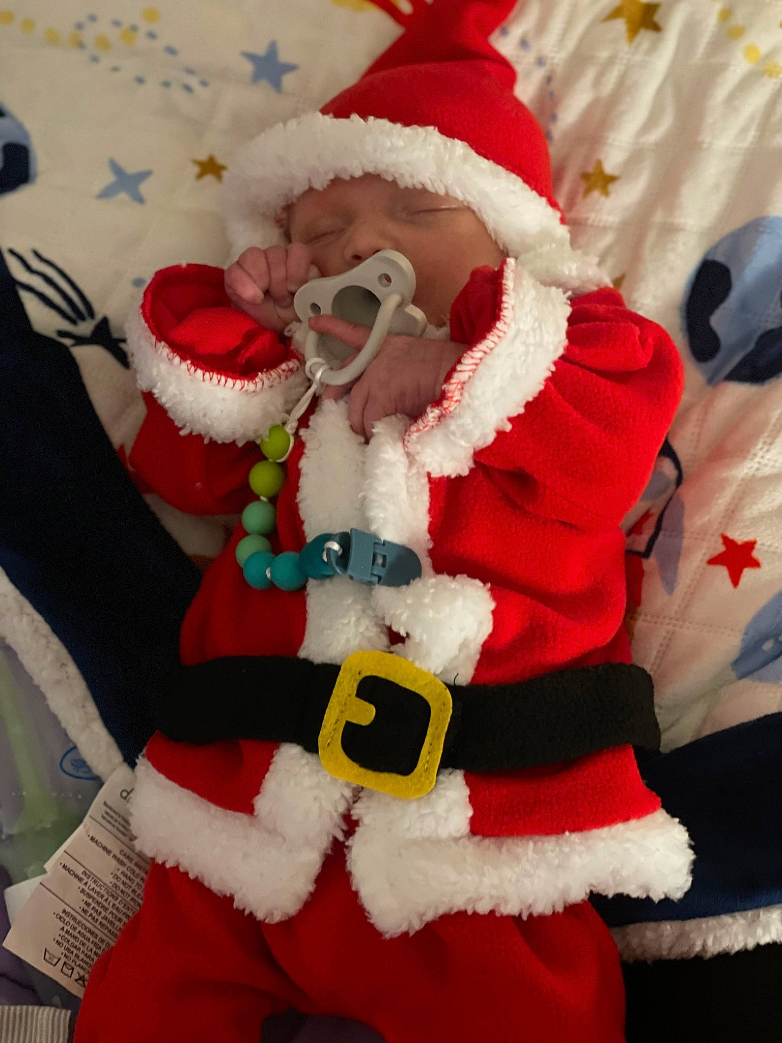 Shylo is registered to the contest to win money with this photo: beard, carmine, christmas, christmas_decoration, christmas_eve, costume_hat, event, fictional_character, fur, fur_clothing, hat, headwear, holiday, interior_design, lap, person, plush, santa_claus, stuffed_toy, textile