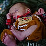 Onyx is registered to the contest to win money with this photo: baby, sleeping, infant, foot, hand, clothing, plaid, blanket, soft, cozy, cute, holiday, gingerbread, child, portrait, closeup, relaxing, peaceful, indoors, cute_outfit