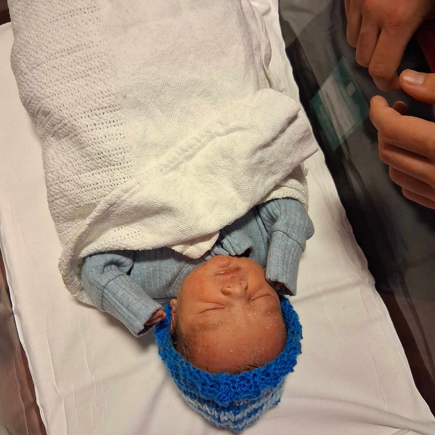 J-D is registered to the contest to win money with this photo: architecture, baby, bed, blanket, bodypart, building, clothing, face, finger, furniture, glove, hand, hat, head, hospital, newborn, person, photography, portrait, sleeping