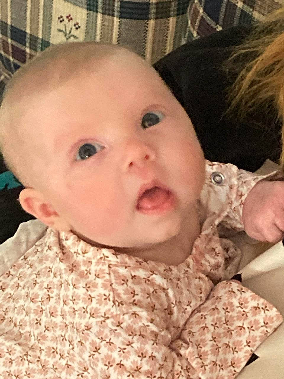 Addison is registered to the contest to win money with this photo: baby, baby_toddler_clothing, cheek, chin, dress, ear, eye, eyebrow, face, facial_expression, gesture, head, human_body, iris, lip, mouth, neck, nose, person, skin