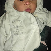 Irina a rejoint le concours — aidez-le/la à gagner de superbes lots ! baby, child, face, person, clothing, white, coat, hat, glove, hand, cute, portrait, warm, winter, dark, night, teddy_bear, embroidery, button, jacket