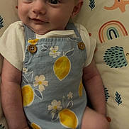 Brinley joined the competition — help win amazing prizes! baby, infant, headband, flower, clothing, pattern, lemons, cushion, rainbow, elephant, hedgehog, smile, face, person, child, cute, indoor, portrait, happy, lying