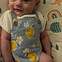 baby, infant, headband, flower, clothing, pattern, lemons, cushion, rainbow, elephant, hedgehog, smile, face, person, child, cute, indoor, portrait, happy, lying
