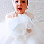 adorable, baby, celebration, child, childhood, cute, face, fashion, flower, happy, headband, indoor, infant, person, portrait, smiling, soft_light, tulle, white_dress, young