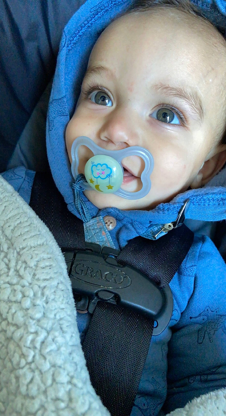 Emanuel is registered to the contest to win money with this photo: azure, baby, baby_toddler_clothing, blue, cheek, child, chin, collar, comfort, electric_blue, eyebrow, eyelash, face, happy, iris, mouth, nose, outerwear, person, sleeve