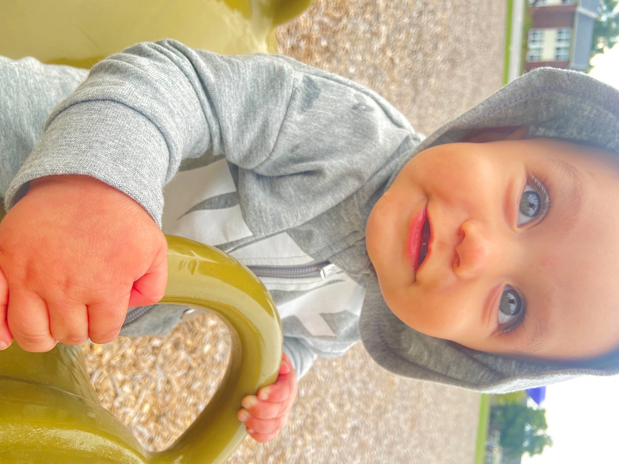 Emanuel is registered to the contest to win money with this photo: baby, baby_toddler_clothing, child, comfort_food, cuisine, dish, eyelash, food, grass, hand, happy, hat, person, plant, recipe, sitting, smile, sun_hat, toddler, tree