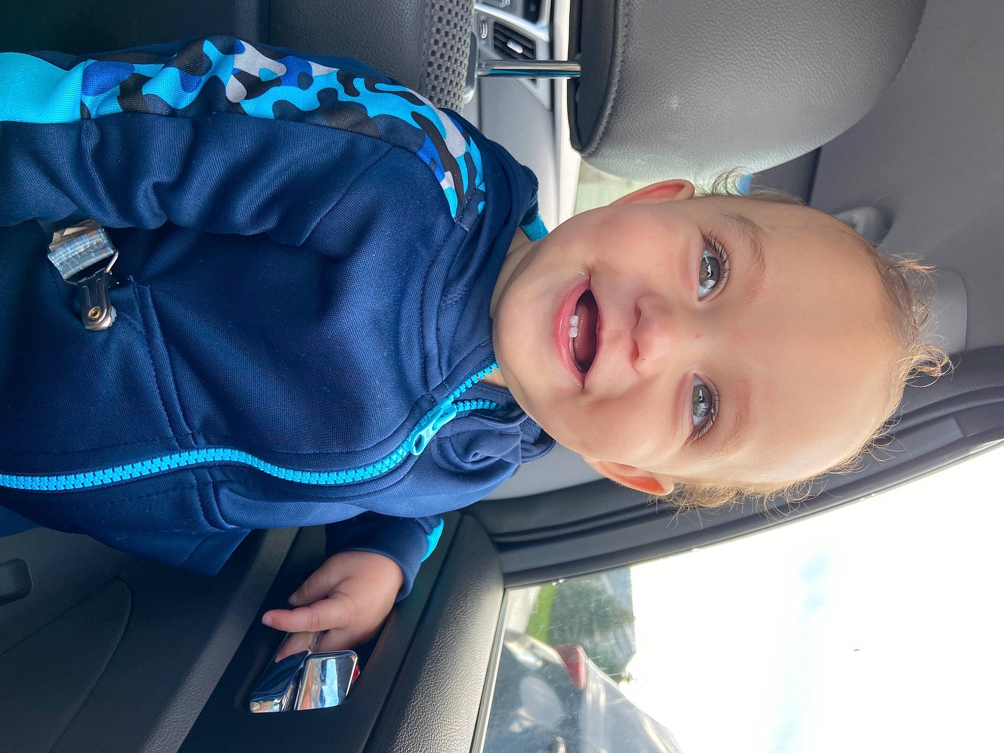 Emanuel joined the competition — help win amazing prizes! auto_part, automotive_design, baby, baby_toddler_clothing, car, child, cool, electric_blue, facial_expression, fun, happy, light, mouth, nose, person, product, smile, toddler, vehicle_door, window