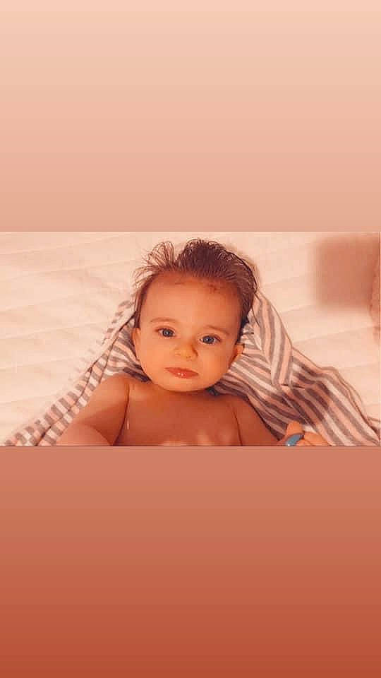 Kaia is registered to the contest to win money with this photo: baby, beige, cheek, child, child_model, face, head, neck, nose, person, photography, pink, skin, sky, toddler, vacation