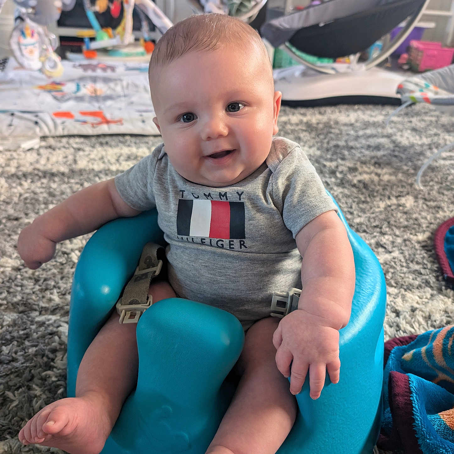 Harlen is registered to the contest to win money with this photo: animal, baby, bodypart, cattle, clothing, cow, face, finger, hand, head, indoors, livestock, outdoorplayarea, outdoors, pants, person, photography, playarea, portrait, sitting