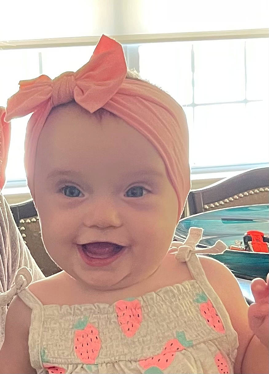 Aurora is registered to the contest to win money with this photo: baby, baby_toddler_clothing, cheek, chin, ear, eye, eyebrow, eyelash, facial_expression, forehead, happy, head, headwear, iris, joy, lip, mouth, neck, person, pink