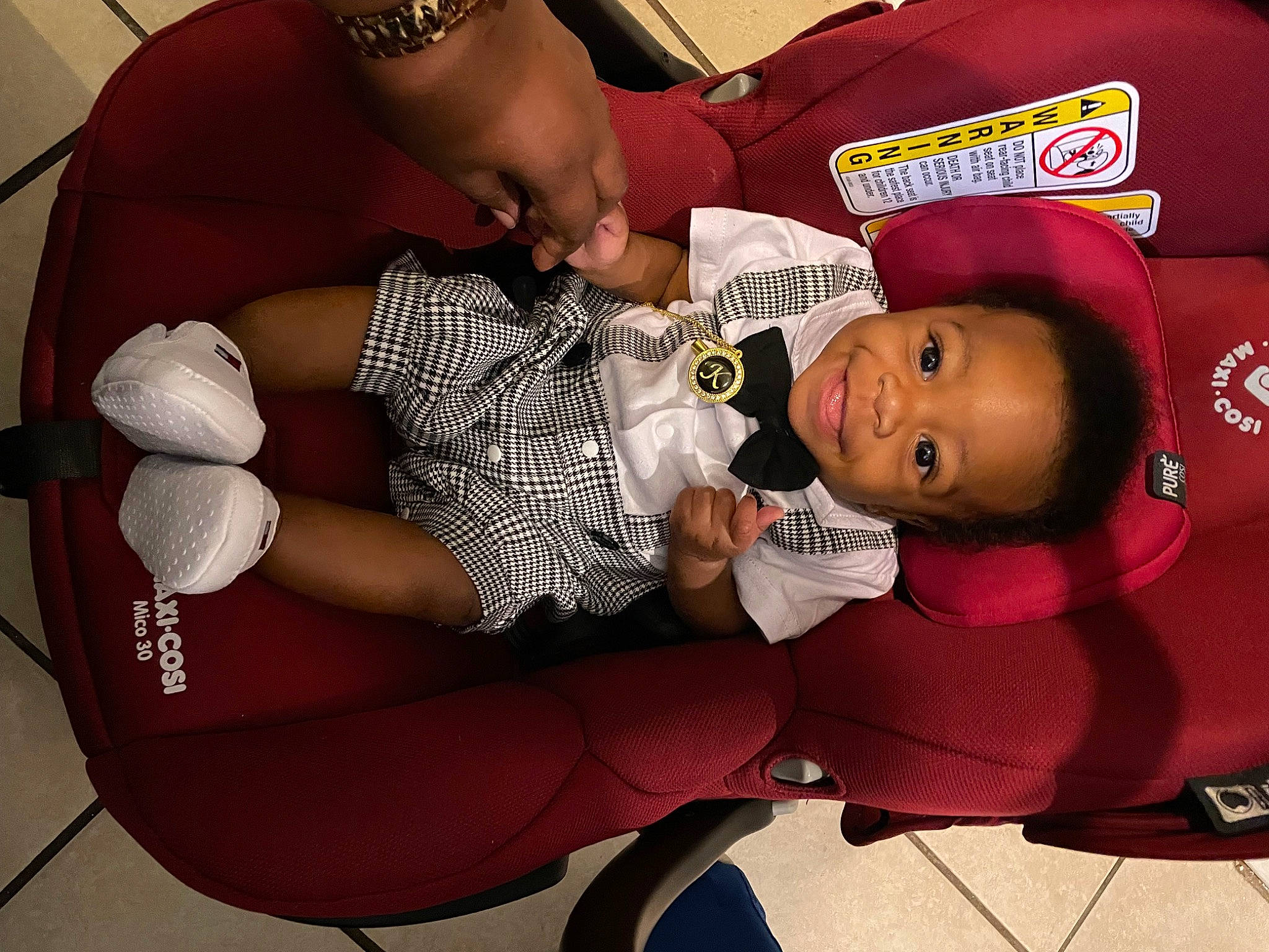 Kordai is registered to the contest to win money with this photo: abdomen, baby, baby_carriage, baby_products, car_seat, carmine, child, comfort, fictional_character, fun, human_leg, joy, knee, lap, pattern, person, product, room, sandal, sitting