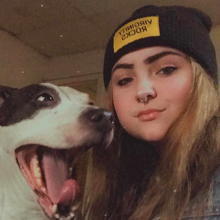 Gurly is registered to the contest to win money with this photo: animal, beanie, brown_hair, casual, closeup, dog, expression, face, friendship, happy, hat, indoor, long_hair, nose_ring, pet, portrait, smile, tongue, woman, young_adult