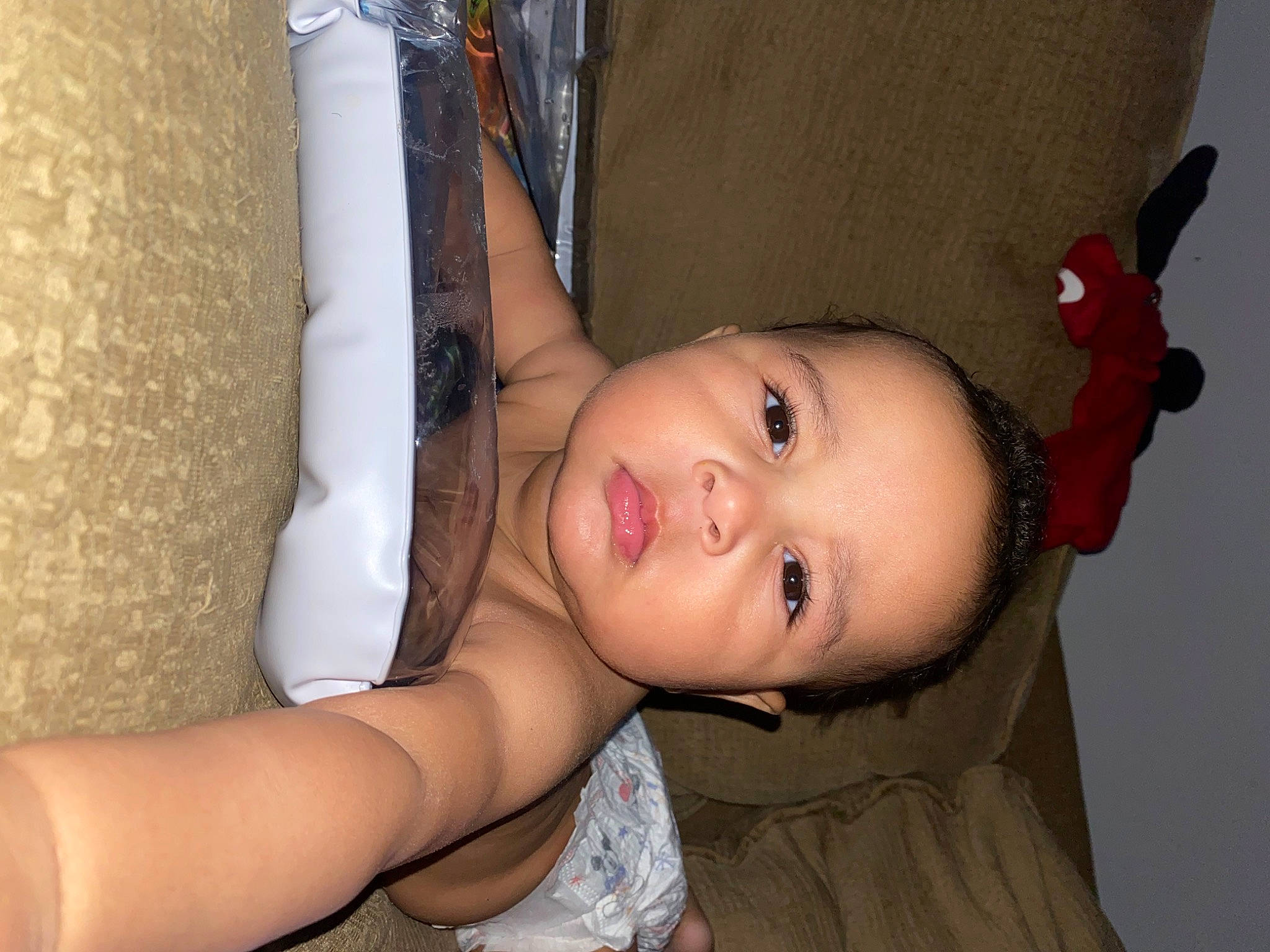 Zayden is registered to the contest to win money with this photo: arm, black_hair, cheek, chest, comfort, eye, eyebrow, eyelash, face, flash_photography, happy, iris, joint, lip, neck, nose, person, skin, toddler, trunk