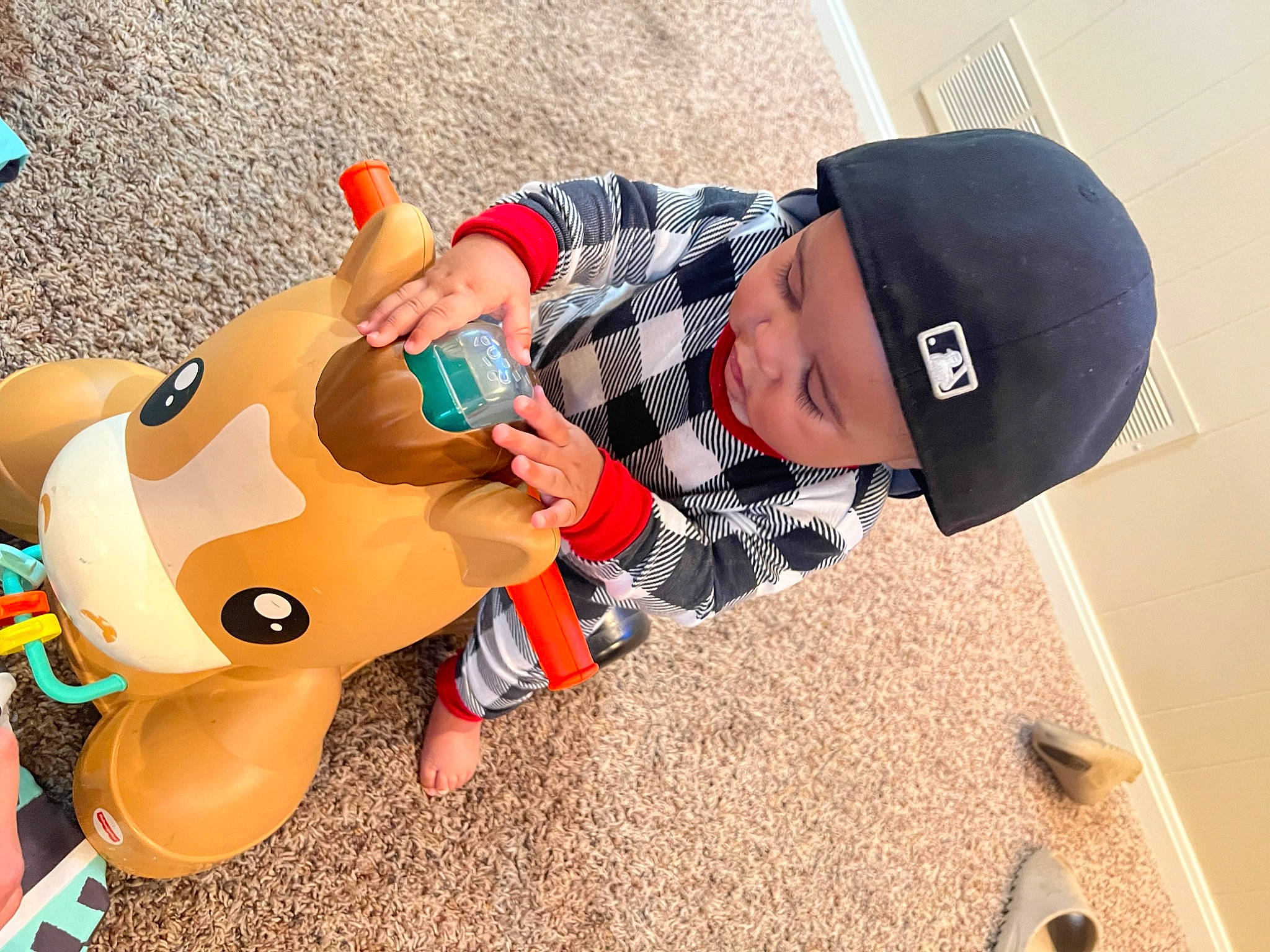 Zayden is registered to the contest to win money with this photo: baby, baby_products, baseball_cap, cap, carmine, child, fun, grass, happy, hat, headgear, headwear, human_body, leisure, person, play, recreation, sand, stuffed_toy, teddy_bear