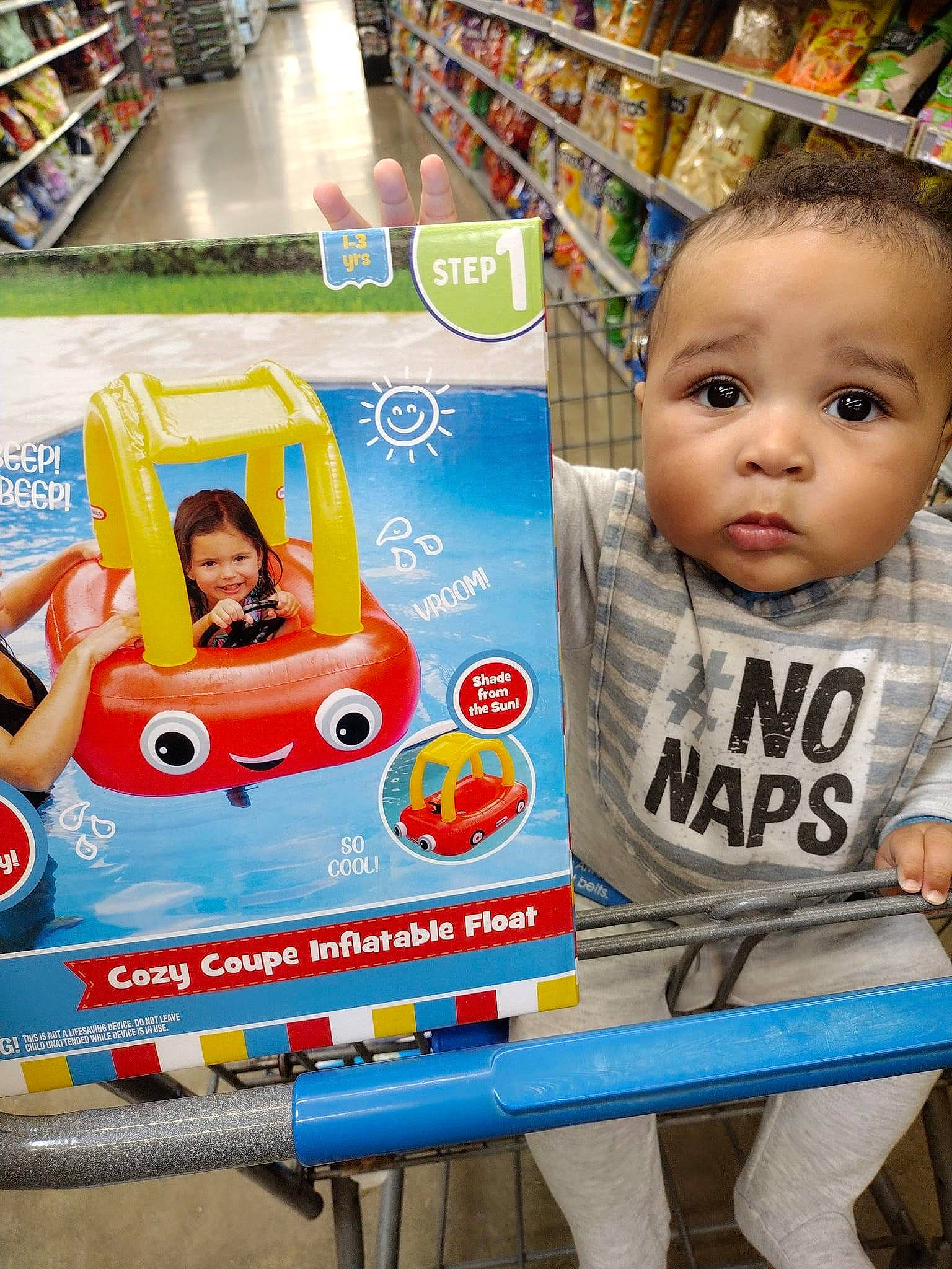 Zayden joined the competition — help win amazing prizes! automotive_exterior, baby, child, convenience_store, customer, fun, joy, leisure, motor_vehicle, person, play, product, publication, recreation, retail, shelf, shelving, toddler, toy, toy_vehicle
