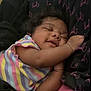 Sylea is registered to the contest to win money with this photo: baby, sleeping, curly_hair, striped_shirt, pastel_colors, blanket, cuddling, peaceful, infant, child, cute, soft, cozy, resting, portrait, indoor, closeup, happy, smiling, person