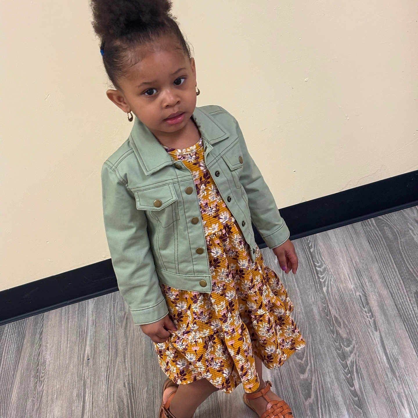 Honesti joined the competition — help win amazing prizes! child, girl, standing, jacket, dress, sandals, hairstyle, floor, wooden_floor, wall, stickers, submarine, rocket, fire_truck, shark, indoor, portrait, casual_clothing, curly_hair, earrings