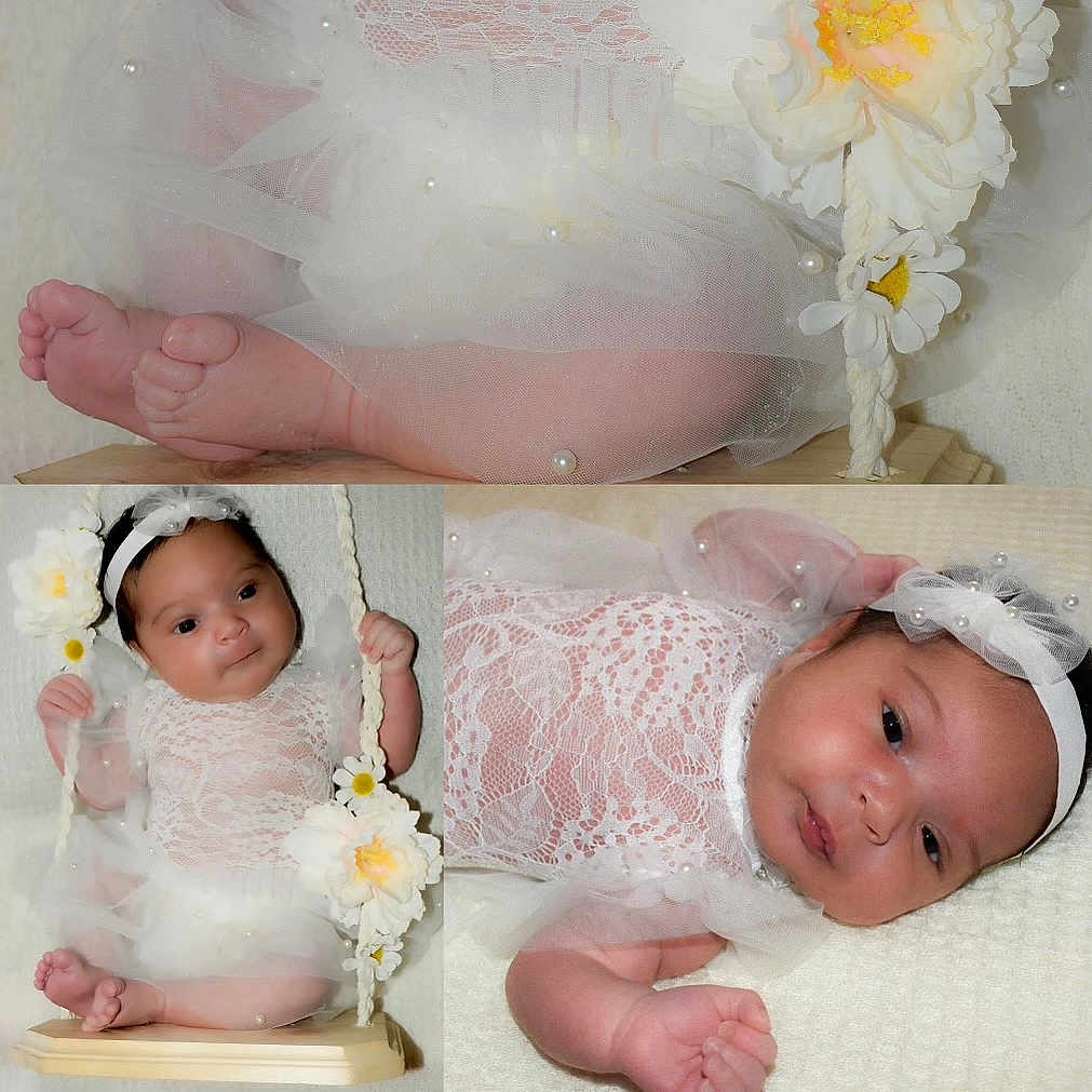 Malaya is registered to the contest to win money with this photo: accessories, baby, bonnet, clothing, crib, dress, face, flower, furniture, hat, head, infantbed, jewelry, necklace, newborn, person, petal, photography, plant, portrait