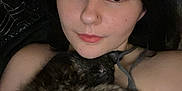 Stella Bean joined the competition — help win amazing prizes! person, cat, sleeping_cat, indoor, cozy, closeup, portrait, relaxed, snuggling, dark_hair, casual_clothing, bedroom, resting, cuddling, animal, pet, comfort, young_adult, facial_piercing, soft_lighting