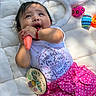 Aylany is registered to the contest to win money with this photo: baby, infant, child, toy, carrot, easter_eggs, bunny_ears, pink_skirt, polka_dot, white_shirt, quilt, smiling, happy, cute, playful, portrait, indoors, celebration, holiday, festive