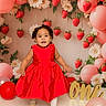 toddler, child, red_dress, balloons, strawberries, flowers, birthday, celebration, one, golden_sign, smiling, indoor, portrait, cute, festive, decorations, happy, standing, party, photography