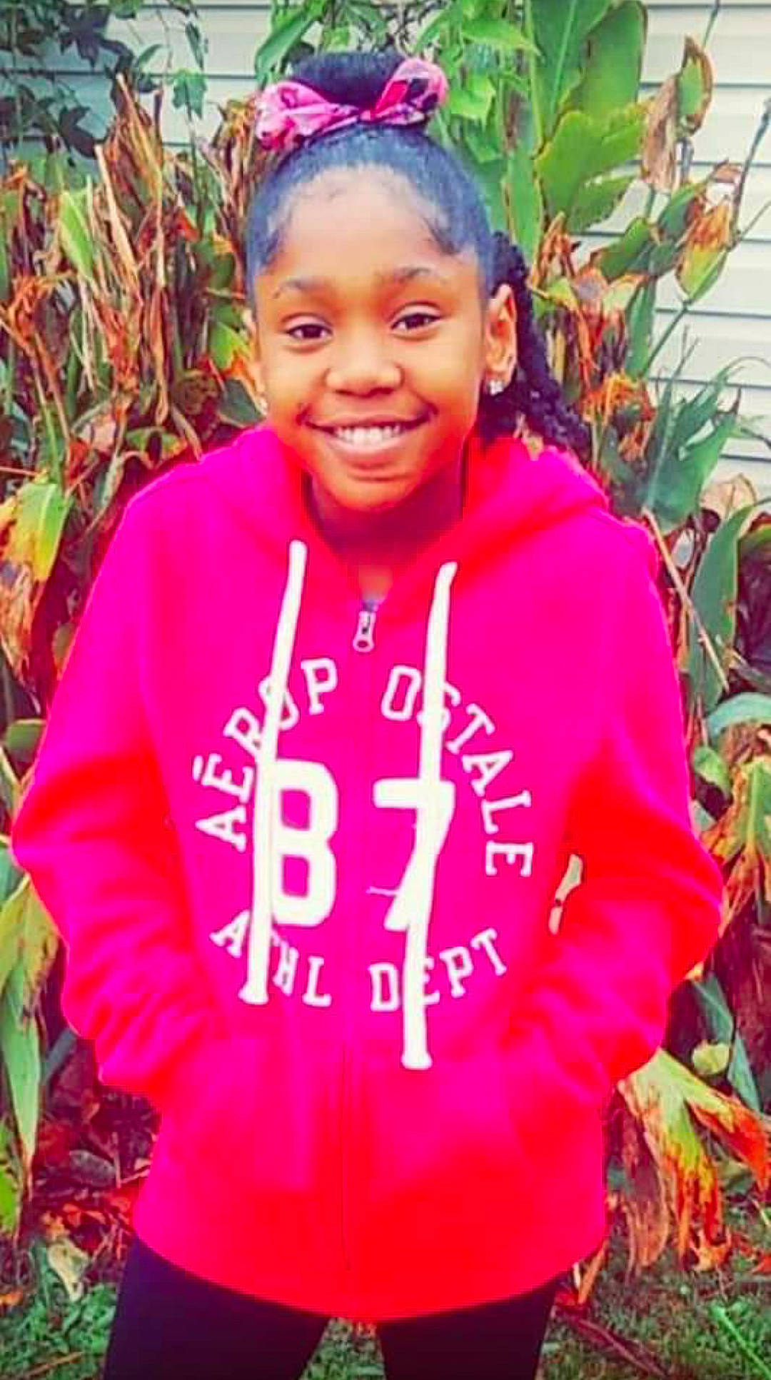 Na'Kia joined the competition — help win amazing prizes! forehead, hoodie, jacket, joy, magenta, outerwear, person, pink, plant, smile