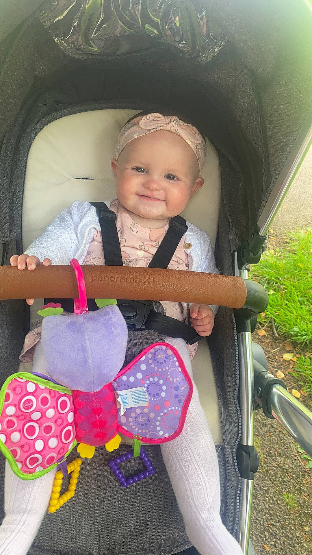 Luna is registered to the contest to win money with this photo: baby, baby_carriage, baby_products, baby_toddler_clothing, bag, car_seat, child, fashion_accessory, happy, head, headwear, joy, leisure, luggage_and_bags, magenta, person, personal_protective_equipment, pink, plant, sitting