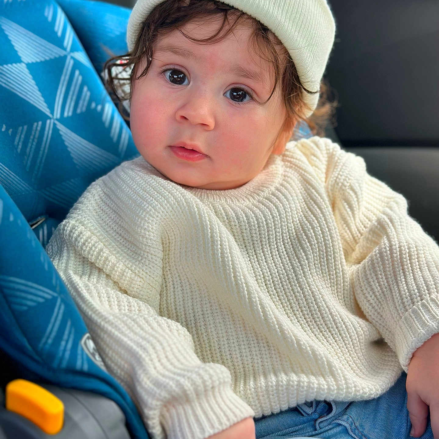Abderrahmane joined the competition — help win amazing prizes! baby, beanie, bonnet, cap, car, car_interior, carseat, clothing, face, hat, head, knitwear, pants, person, photography, portrait, sitting, sweater, transportation, vehicle