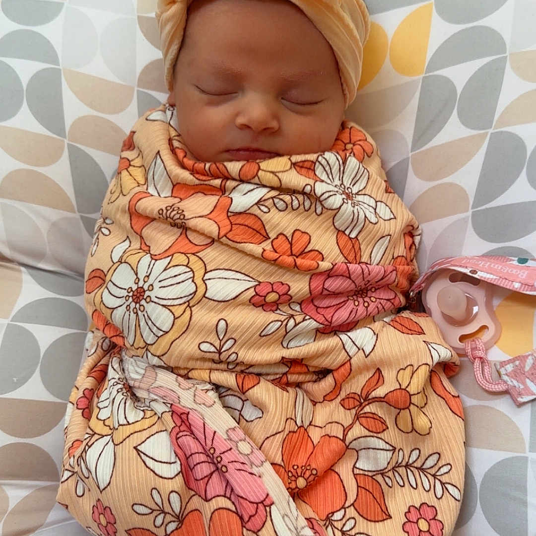 Piper is registered to the contest to win money with this photo: accessories, baby, bed, blanket, bonnet, clothing, couch, cushion, face, furniture, hat, head, headband, homedecor, newborn, person, photography, portrait, quilt, sleeping