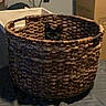 cat, basket, bedspread, keyboard, cardboard_box, indoor, curious, peeking, woven, pet, animal, feline, fur, ears, resting, home, cozy, room, furniture, container