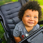 Kayden is registered to the contest to win money with this photo: baby, babylaughing, buggy, clothing, face, grass, hair, happy, head, laughing, lawn, person, photography, plant, portrait, smile, stroller, t_shirt, transportation, vehicle