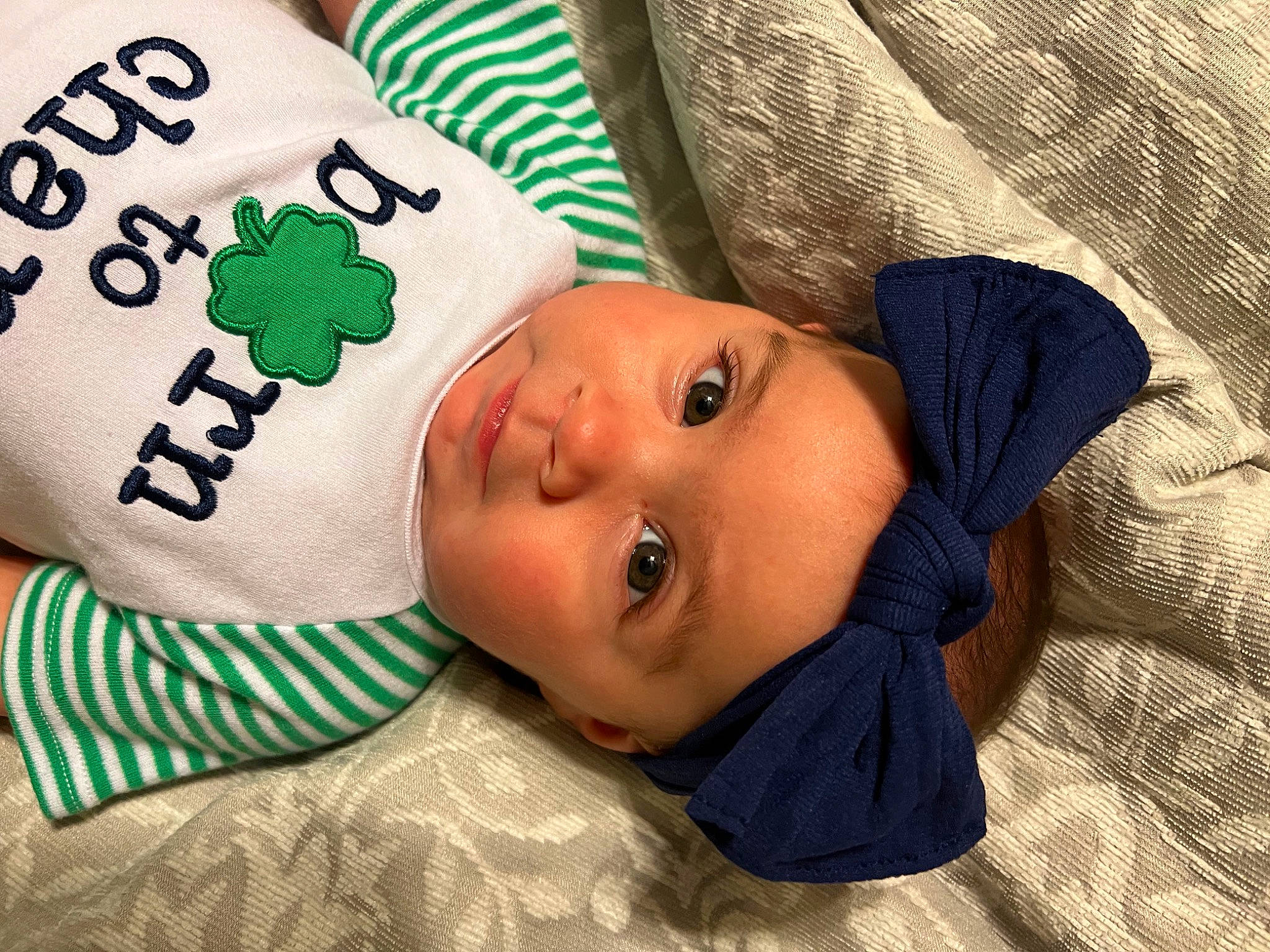 Mercedes is registered to the contest to win money with this photo: baby, baby_products, baby_toddler_clothing, cheek, child, comfort, eye, eyelash, grass, happy, hat, headgear, headwear, linens, pattern, person, room, sleeve, toddler, tree