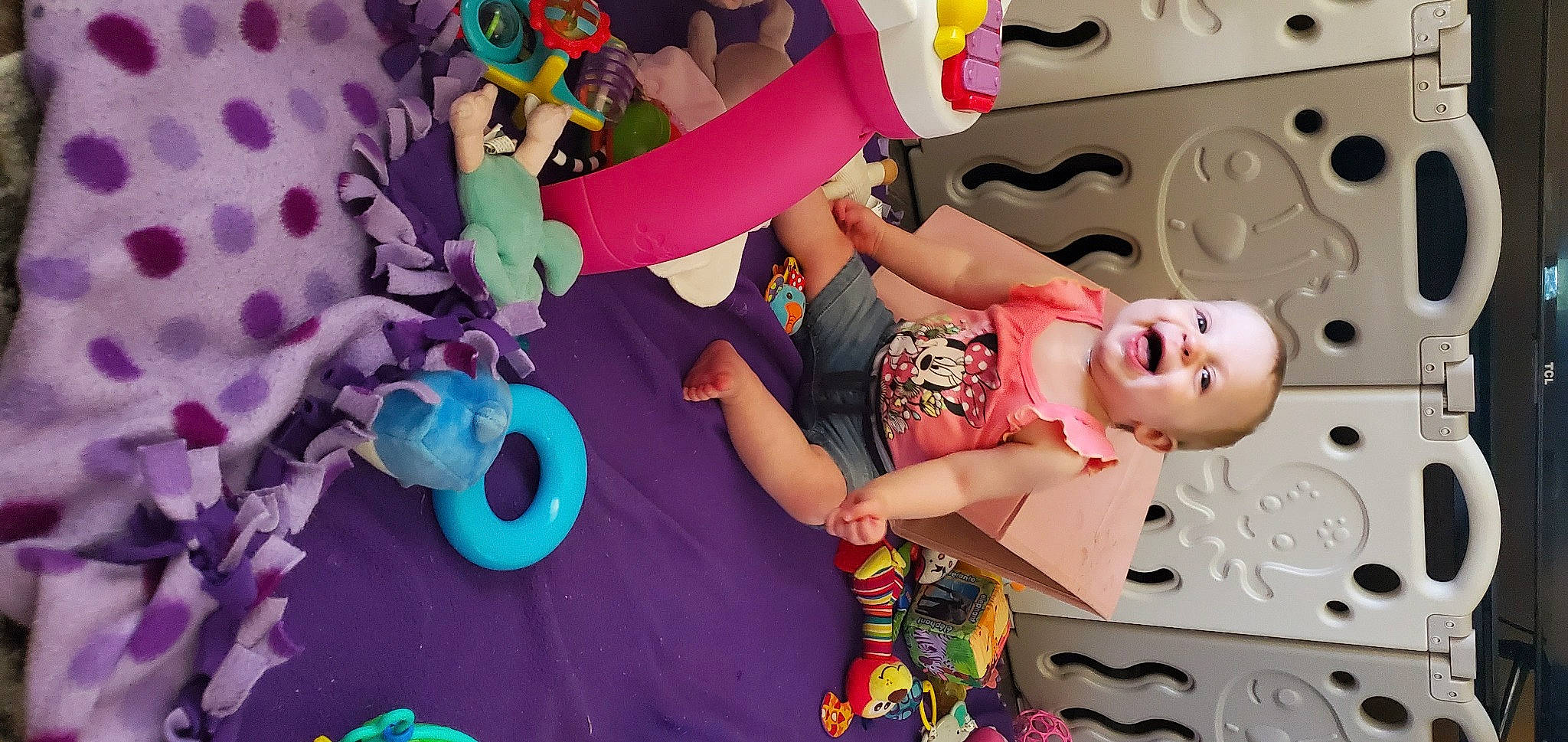 Elliemae is registered to the contest to win money with this photo: child, design, font, fun, happy, human_leg, leg, leisure, magenta, pattern, person, pink, play, purple, room, snapshot, stuffed_toy, textile, thigh, toddler