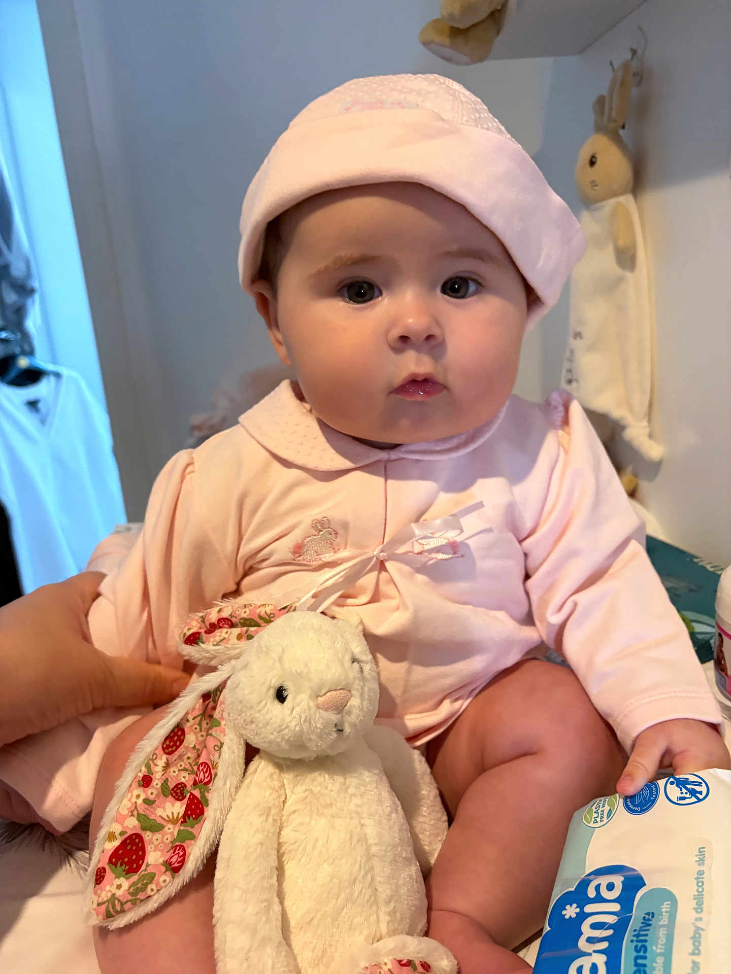 Sayloir Bleu joined the competition — help win amazing prizes! baby, child, infant, pink_clothing, hat, stuffed_animal, bunny_toy, hand, indoor, cute, soft_toy, person, sitting, face, chubby_cheeks, toy, clothing, expressionless, skin, holding