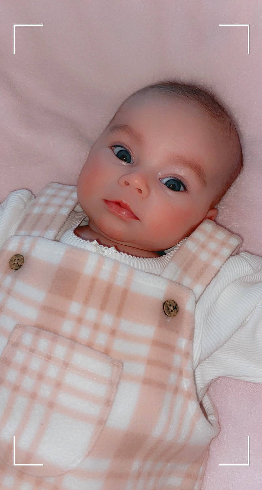 Ava-leigh is registered to the contest to win money with this photo: baby, baby_toddler_clothing, cheek, collar, comfort, dress_shirt, eyelash, linens, lip, nose, pattern, peach, person, pink, plaid, skin, sleeve, tartan, textile, toddler
